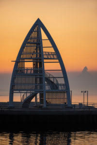 Germany, Lower Saxony, East Frisia, Juist, sunrise mood at the port entrance with the sea mark (17 m high steel structure). Germany, Lower Saxony, East Frisia, Juist, sunrise mood at the port entrance with the sea mark (17 m high steel structure).